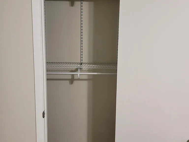 Custom closet located in third bedroom for plenty of storage area.