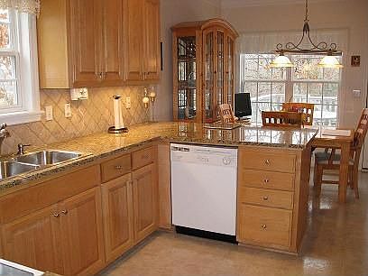 Maple cabinets and recessed lighting.