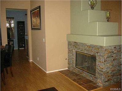 Brick fireplace and wood floors