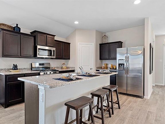 All photos shown here may not depict the specified home & features included are for illustration purposes only.