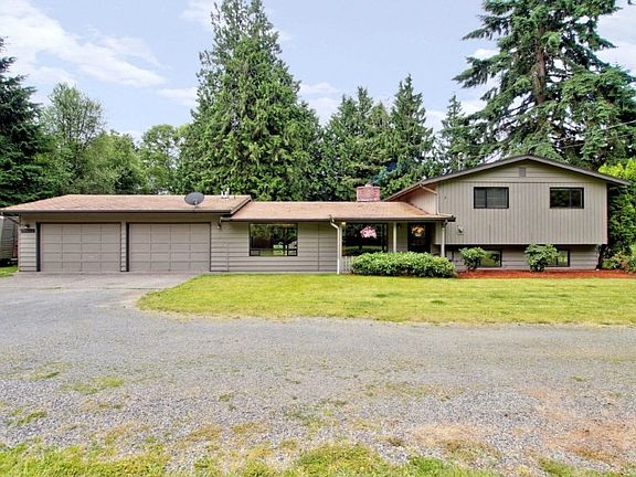 ANOTHER VIEW OF THE FRONT OF THE HOUSE WITH 2 CAR OVERSIZED GARAGES...COULD FIT 3 CARS IF 2 WERE SMA