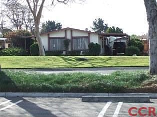 Front of home located across from green belt