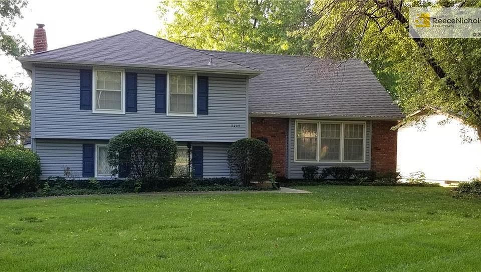 Corner Lot, permanent siding Well maintained and walk to all the Red Bridge Shopping Center Amenities