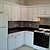 Kitchen gas stove,vent,refrigerator,ceramic tile backsplash