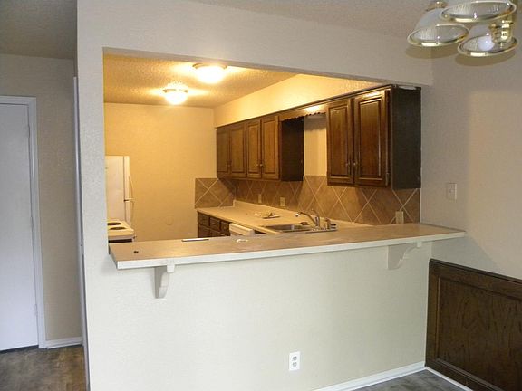 Kitchen has stove and dishwasher