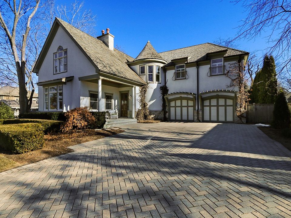 Stunning curb appeal enhanced by a brick paver driveway