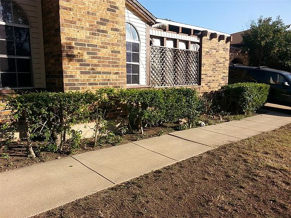 Private patio behind lattice screen.