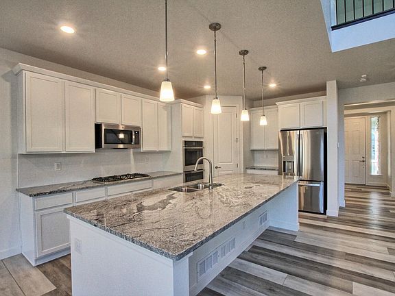 Chef's gourmet kitchen with 36" gas range and double ovens