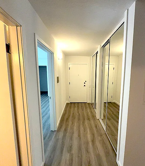 Entryway looking at front door. The mirrored doors on the right are 2 very large closets