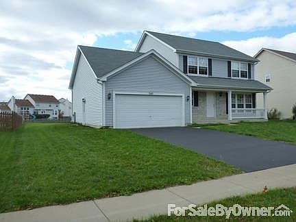 FRONT AND SIDE VIEW OF THE HOUSE
						:
						2 CAR GARAGE ,SMALL PORCH,SIDE DOOR ON GARAGE