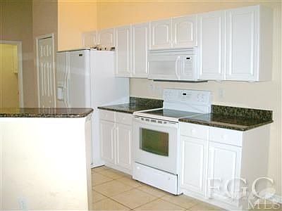 Kitchen with Granite Counters & Tile Floors
