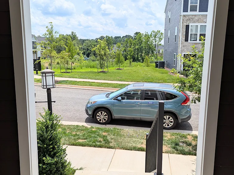 Looking out your FRONT door at greenspace and walking trail to Crozet Park. Additional on street parking
