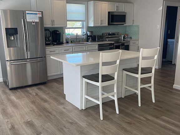 Open kitchen. Island with stools