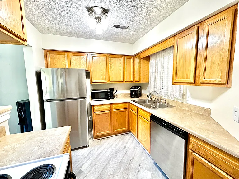 Kitchen with New Refrigerator and New Dish Washer