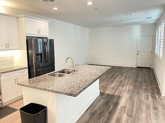 Large open living room. kitchen and dining room. Patio is off the dining room.