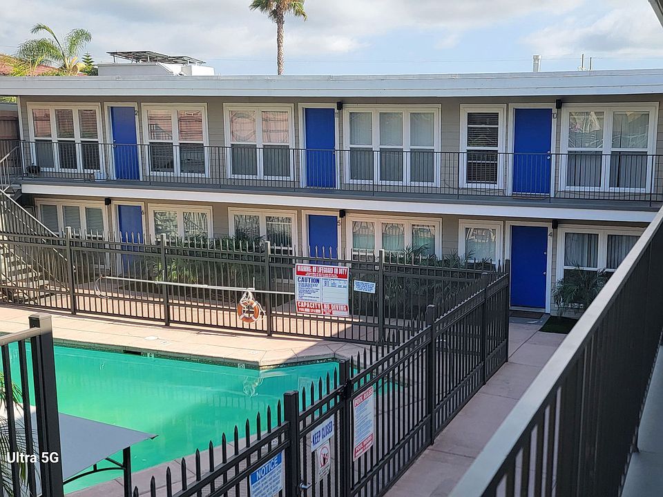 View of swimming pool from second floor veranda at 5747 Lauretta Street Apartments in San Diego, California.