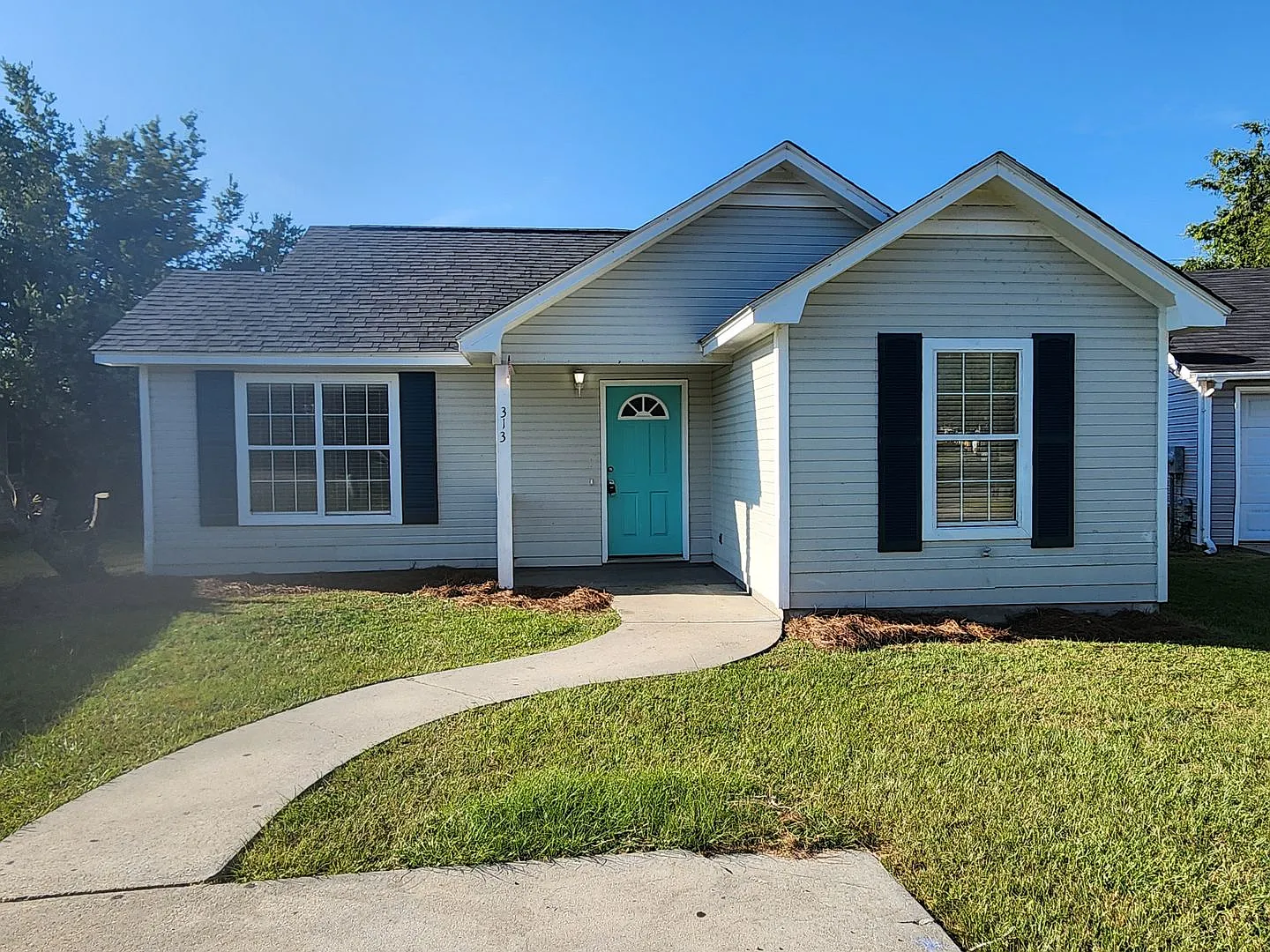 Bright & Inviting 3-Bedroom Home with Open Layout and Fenced Backyard — Photo 1