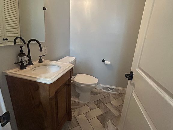 1/2 bath with storage closet