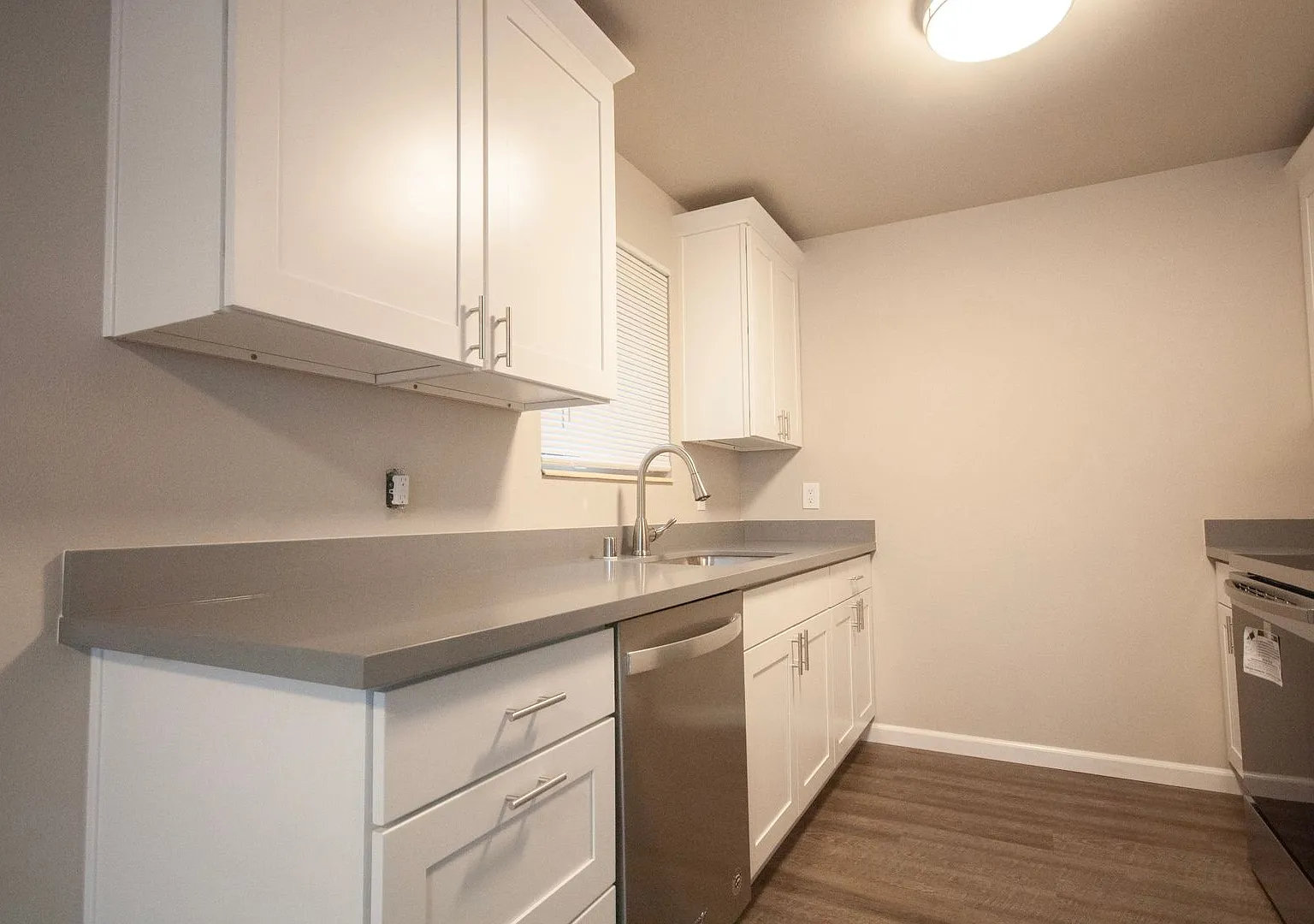 Quiet Apartment Living with In-Unit Laundry and Assigned Parking — Photo 2