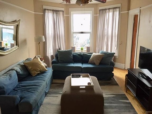 Living room with entrance to bedroom 3 on the right.
