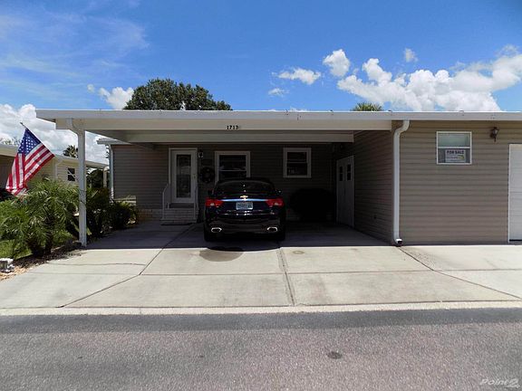 TWO CARS FIT UNDER CARPORT