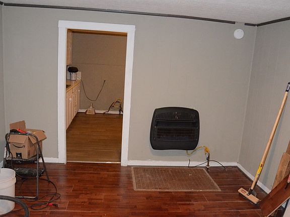 Living room with House Vent-less gas heater (tools to be removed). Notice: stove not yet installed.