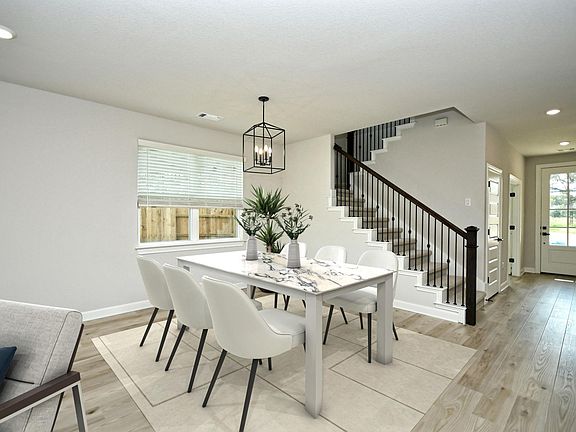The dining area is large enough for your favorite dining table. Virtually staged.