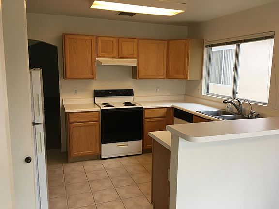 View of kitchen from kitchen dining area. Newer stove installed in last 18 months.