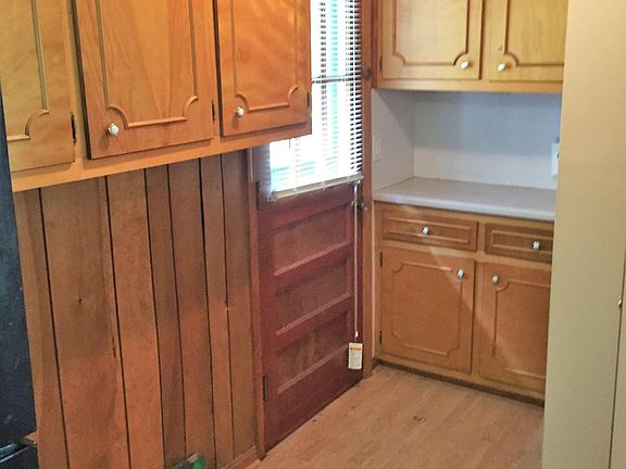 Indoor washer/dryer location with extra storage.