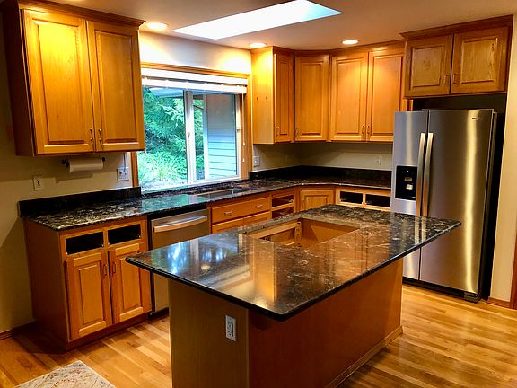 New induction stovetop, new dishwasher, new refrigerator, new clothes washer and dryer (not shown).