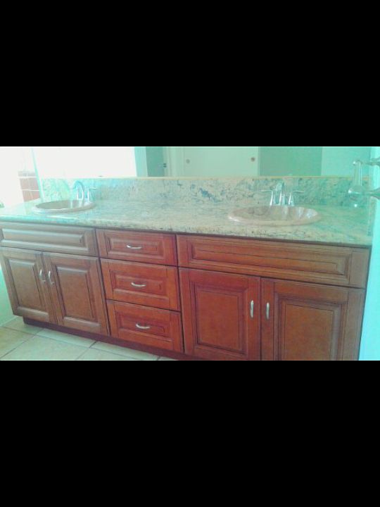 His and hers Brazilian granite counter with marble shell sin