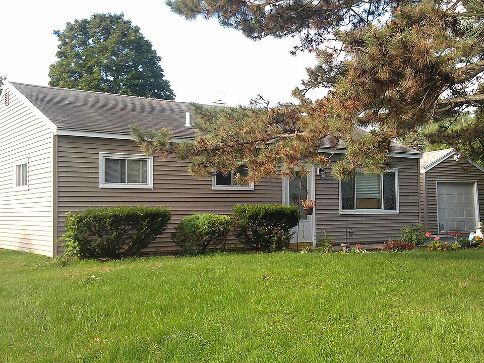 Updated exterior featuring new siding 2011, beautiful landscaping
