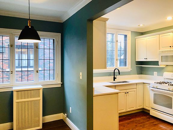 NEWLY UPDATED! Eat in kitchen with microwave, gas stove, new garbage disposal, refrigerator, dishwasher and TWO sinks. Brand new paint, brand new quartz counter tops, brand new sinks and faucets. New kitchen pennant light with leather accents. Original