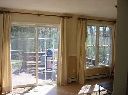 Den with access to deck and backyard