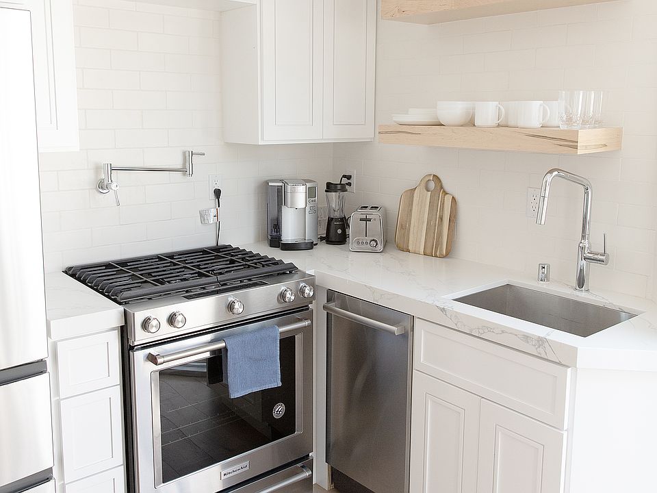 Full Kitchen with fridge, stove, oven, and dishwasher, plates and utensils