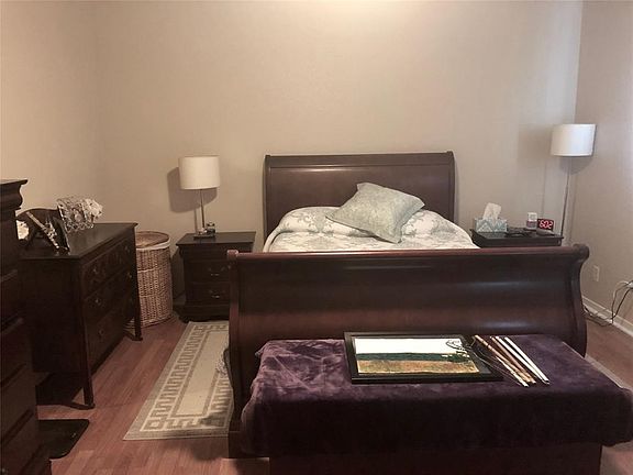 Master bedroom is spacious with nice wood floors to cut down on allergies.