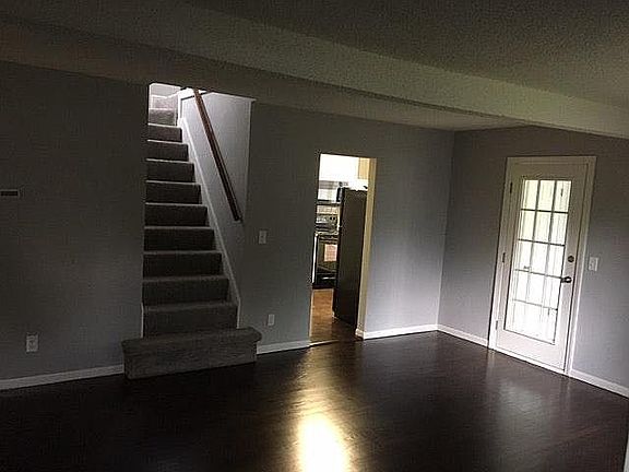 Living room with entrance to loft