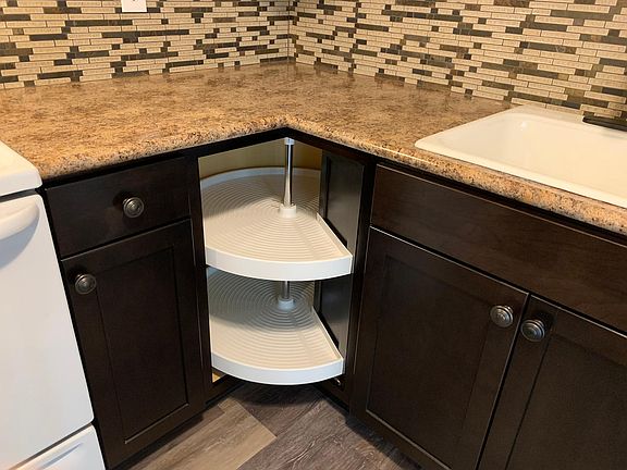Built-in lazy susan, new faucet and cast iron sink.