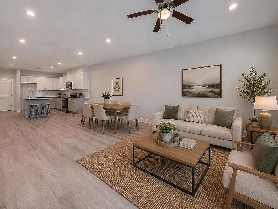 Open-concept living room flowing seamlessly into the kitchen.