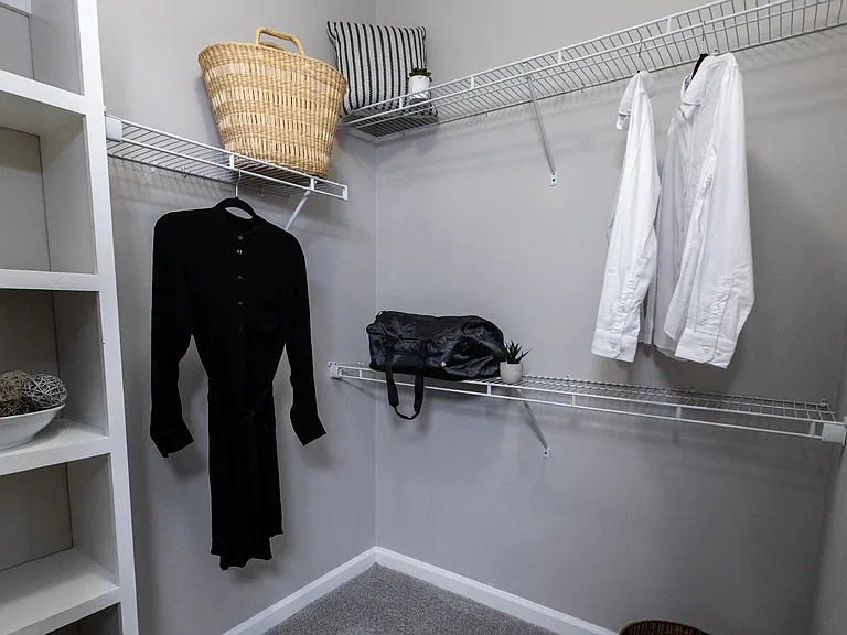 Effortlessly organize with custom shelving in our oversized walk-in closets - tailored with you in mind!