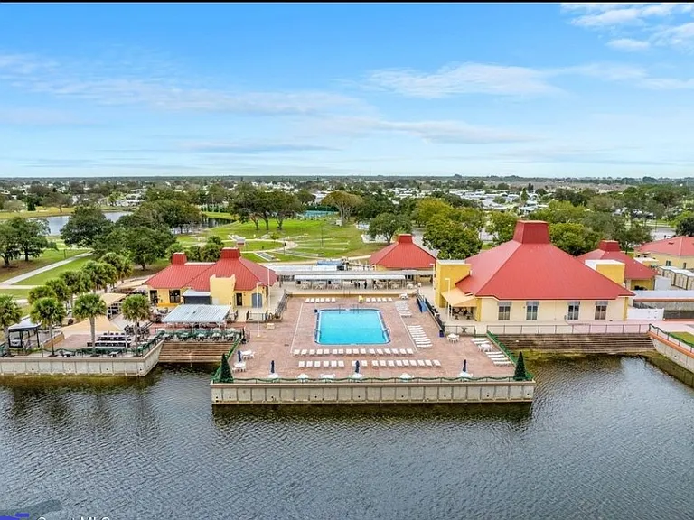 Aerial view of Pool #1, Outdoor Stage, Building A, Pool room with meeting area.