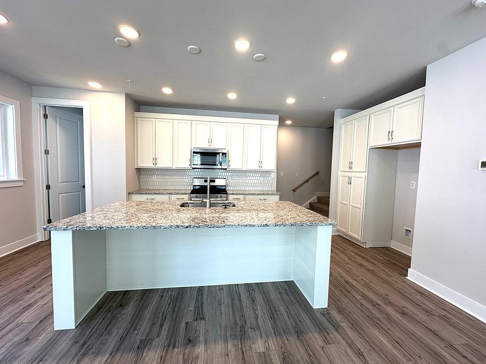 cabinets in a vanilla finish, granite countertops and stainless steel appliances!