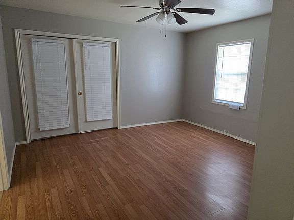 Front living space that opens up to the kitchen could be a formal dining area, office, playroom, or extra TV room.