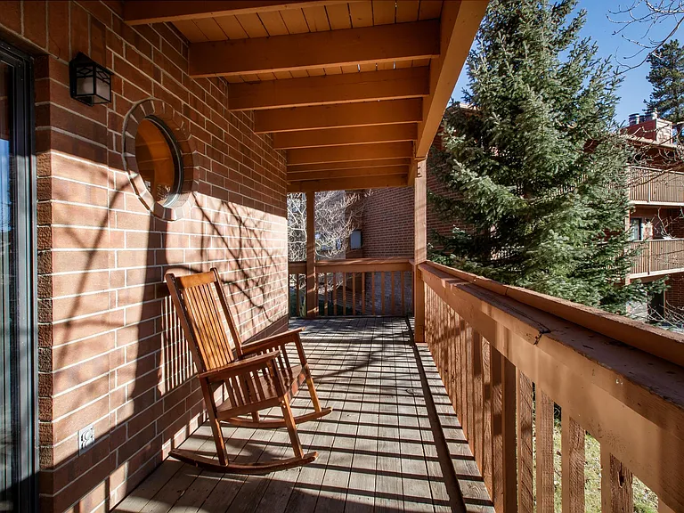 Wrap around porch by living room and kitchen