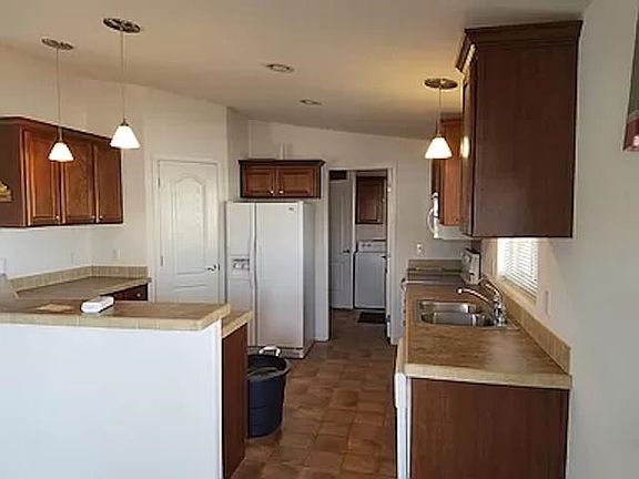 4th image of 13827 E 49th Ln