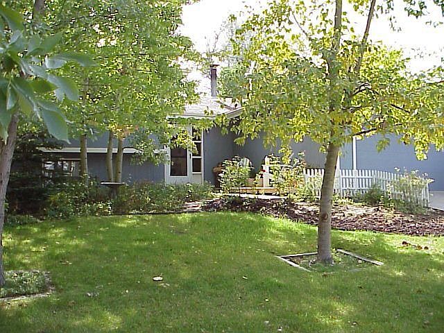 front of house with wonderful mature trees