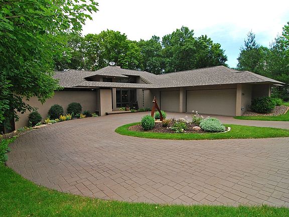 Nesteled on 1 1/2 acre wooded lot