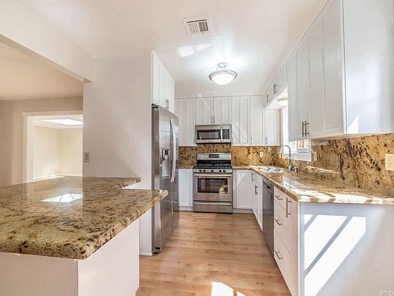 Fully remodeled kitchen with new appliances, ample cabinet space, and generous storage