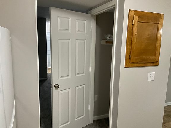 Coat closet off of kitchen