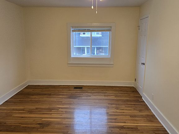 Livingroom, with ceiling fan, window view of the street.